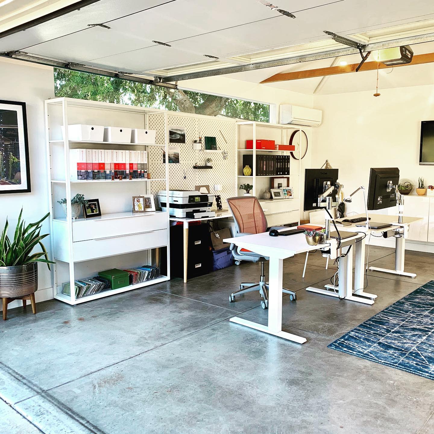 office garage conversion concrete floor white office tables 